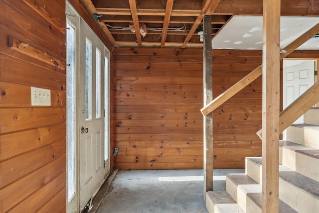 interior space featuring wood walls