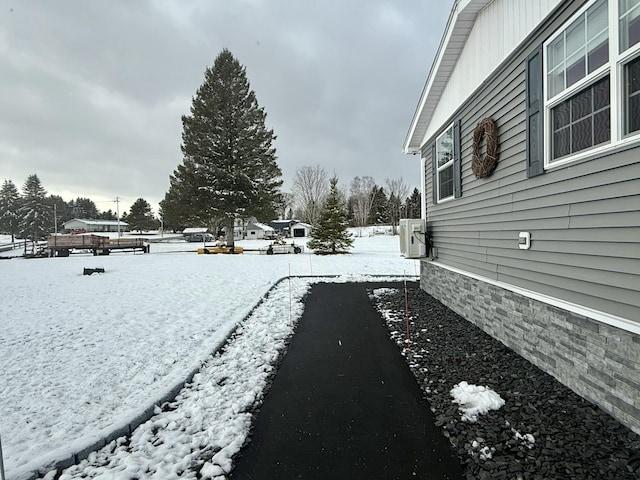 snowy yard with ac unit