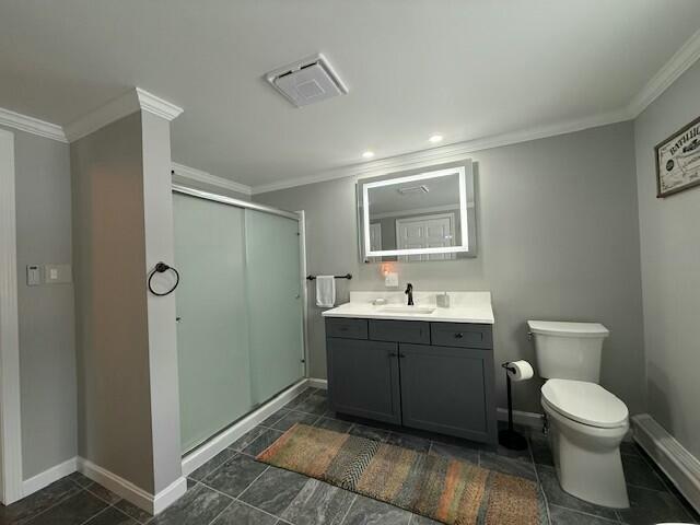 bathroom featuring vanity, walk in shower, and crown molding