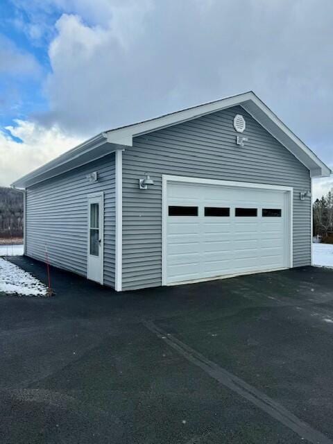 1063 Main St, Saint Francis, ME 04773 - view of side of property with an outbuilding and a detached garage