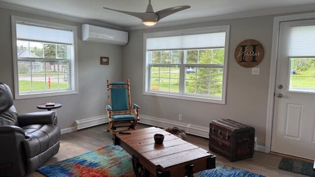 1063 Main St, Saint Francis, ME 04773 - sitting room with a wall unit AC, healthy amount of natural light, ceiling fan, and crown molding
