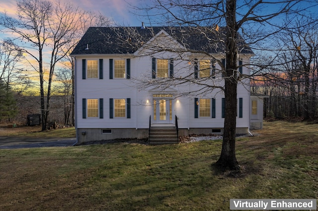 colonial house featuring a yard