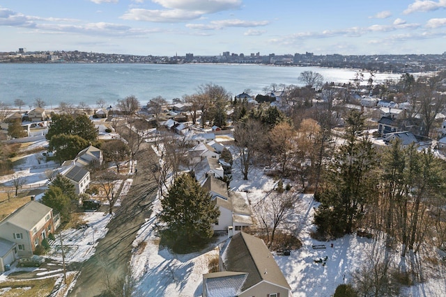 snowy aerial view with a water view