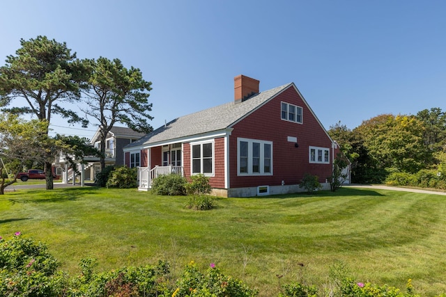 view of side of home featuring a yard