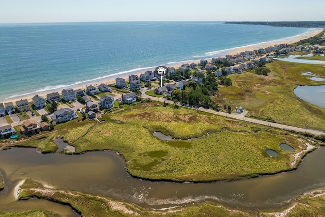 drone / aerial view featuring a view of the beach and a water view