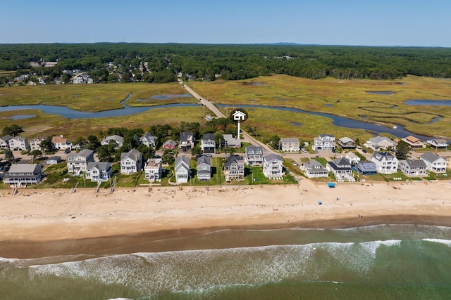 bird's eye view featuring a water view and a view of the beach