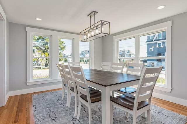 dining area with hardwood / wood-style floors