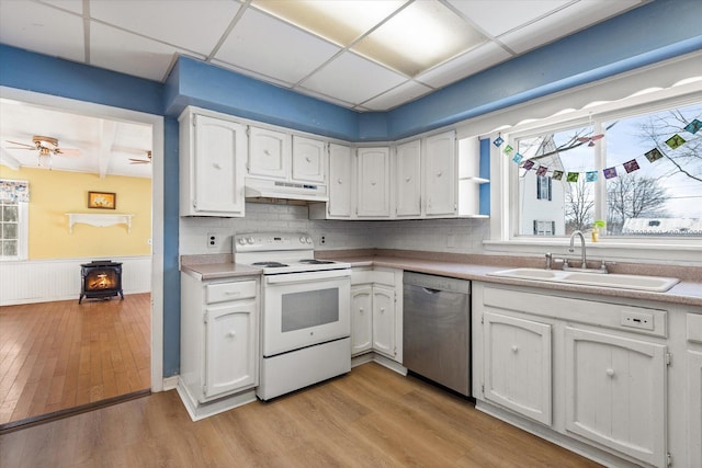 kitchen featuring white cabinetry, sink, dishwasher, and white electric range