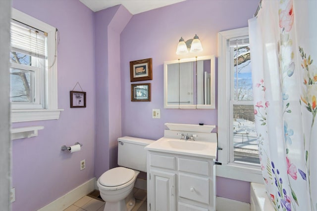 bathroom featuring tile patterned floors, vanity, and toilet