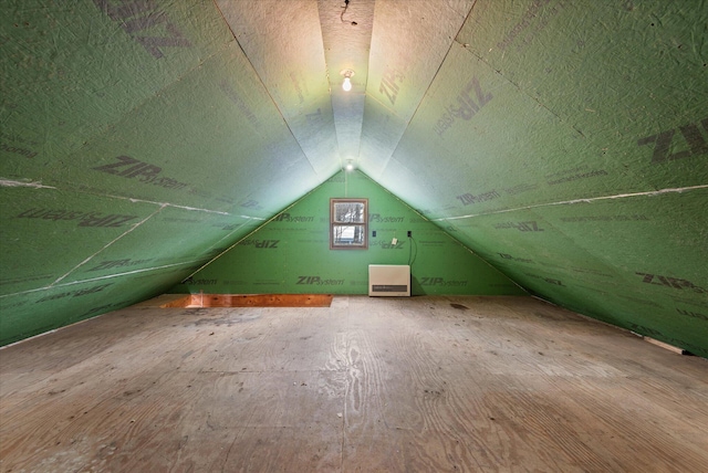 additional living space featuring lofted ceiling