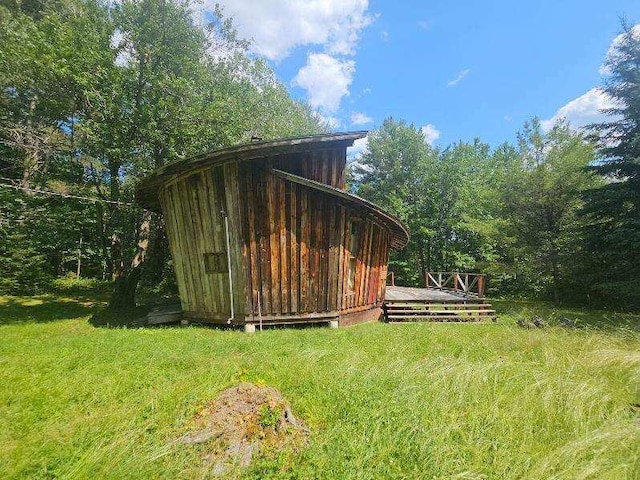 view of outdoor structure with a lawn