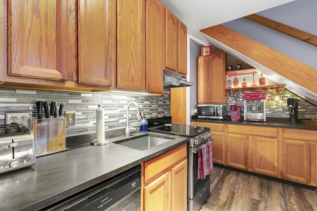 8 Sunrise Dr Unit C122, Newry, ME 04261 - kitchen featuring a sink, stainless steel appliances, under cabinet range hood, backsplash, and dark countertops