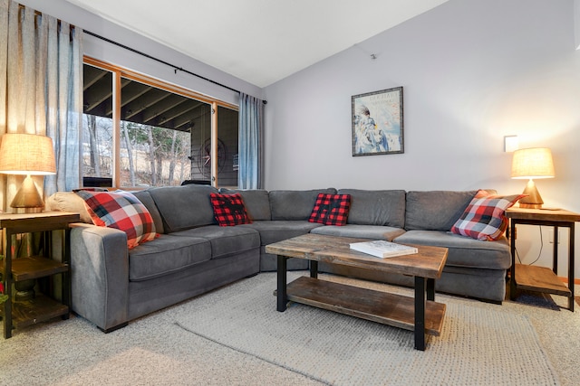 living room with carpet and vaulted ceiling