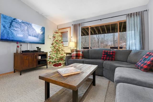 living room featuring light colored carpet and vaulted ceiling