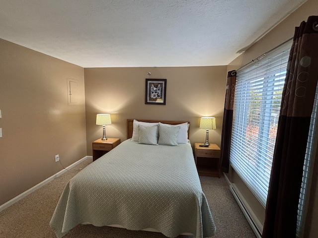 bedroom featuring carpet floors and baseboard heating