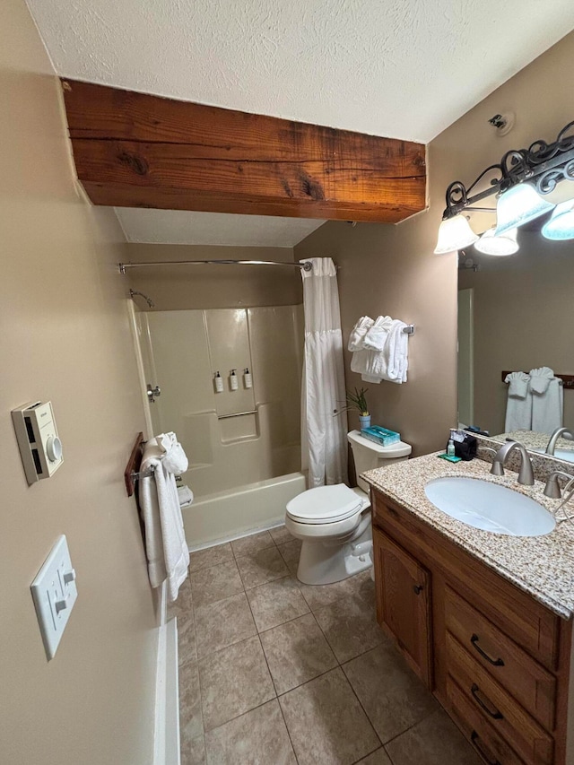 full bathroom featuring tile patterned floors, a textured ceiling, vanity, shower / tub combo with curtain, and toilet