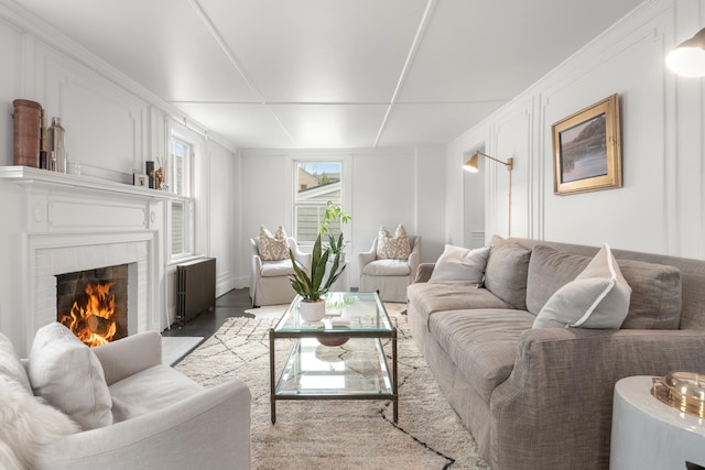 living room featuring radiator heating unit and light hardwood / wood-style floors