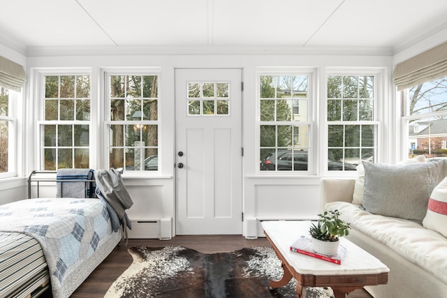 sunroom / solarium featuring a baseboard heating unit