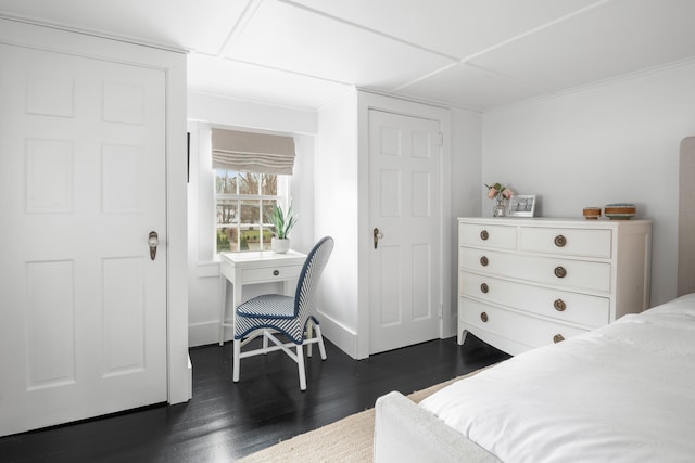 bedroom with dark hardwood / wood-style floors