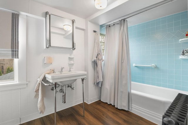 bathroom with shower / bath combination with curtain and wood-type flooring