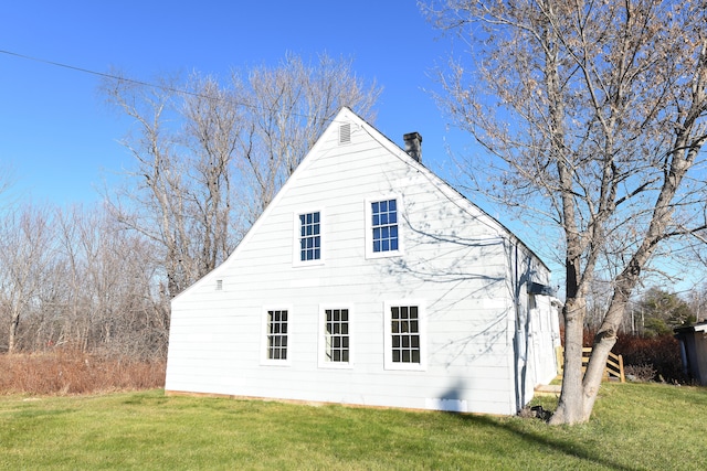 view of home's exterior featuring a yard