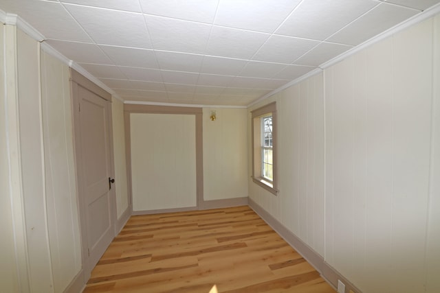 interior space featuring light hardwood / wood-style floors and ornamental molding