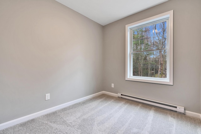 unfurnished room with carpet flooring and baseboard heating