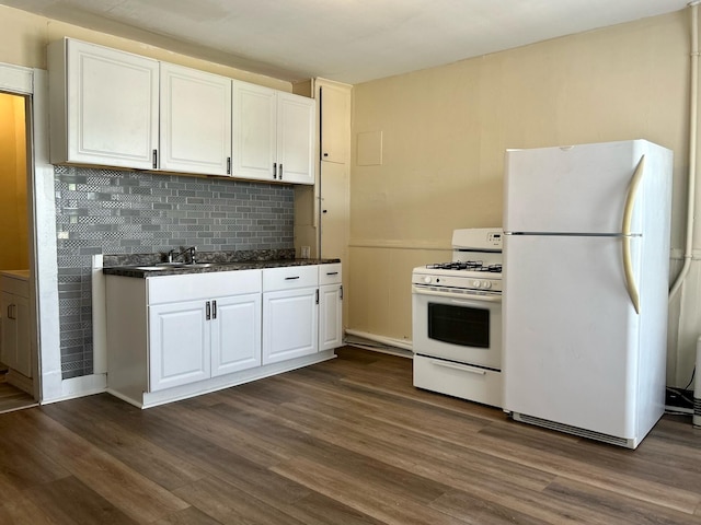 kitchen featuring dark hardwood / wood-style flooring, tasteful backsplash, white appliances, sink, and white cabinetry