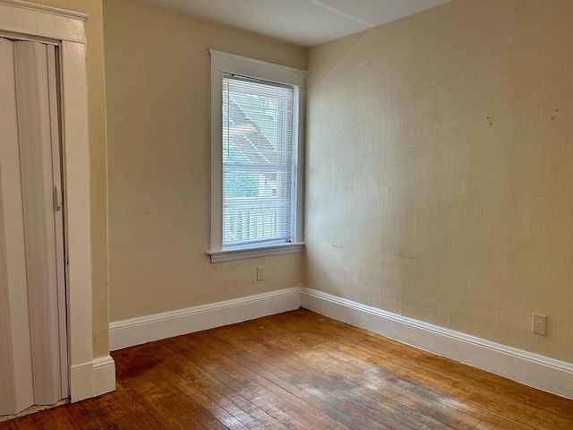 unfurnished room featuring hardwood / wood-style flooring