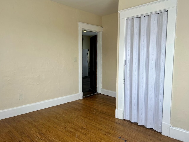 spare room with wood-type flooring