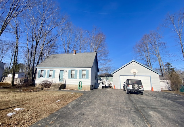 view of front of home with an outdoor structure and a garage