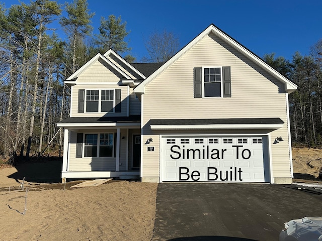 view of front of house featuring a porch and a garage