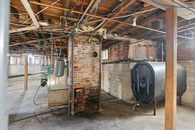 basement featuring brick wall