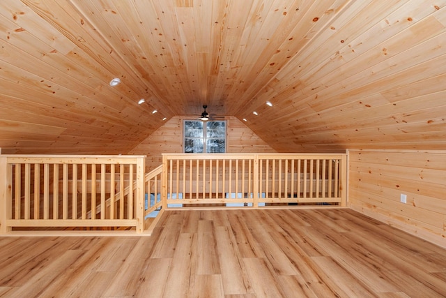 bonus room with wood walls, hardwood / wood-style floors, lofted ceiling, and wood ceiling