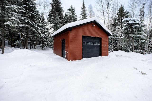 view of snow covered garage