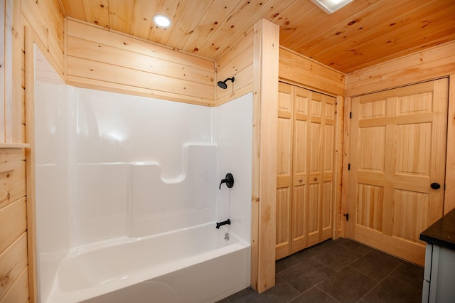 bathroom featuring wood ceiling, bathtub / shower combination, and wooden walls