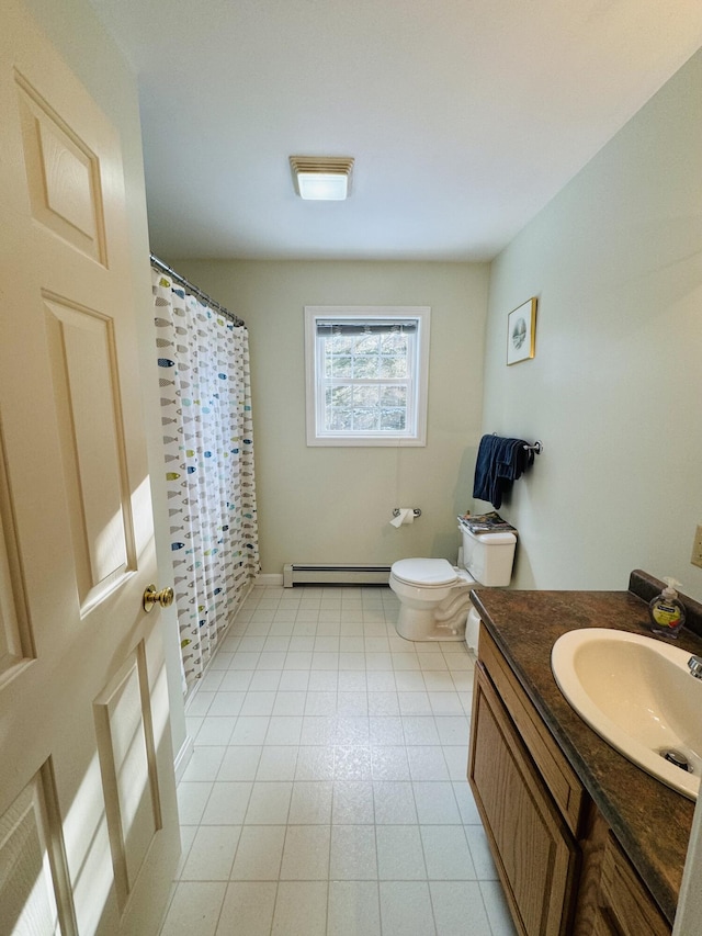 bathroom featuring tile patterned floors, vanity, toilet, and baseboard heating