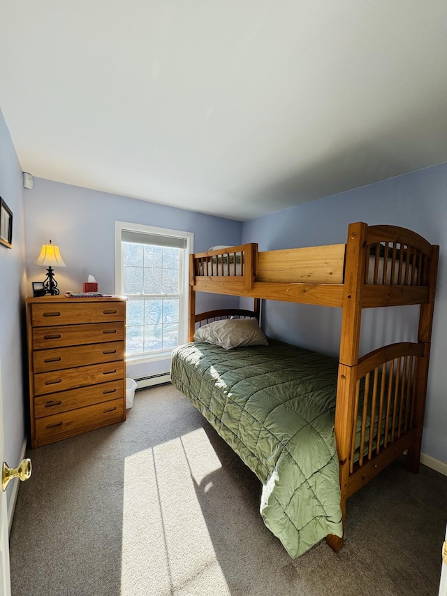 carpeted bedroom featuring baseboards and a baseboard radiator