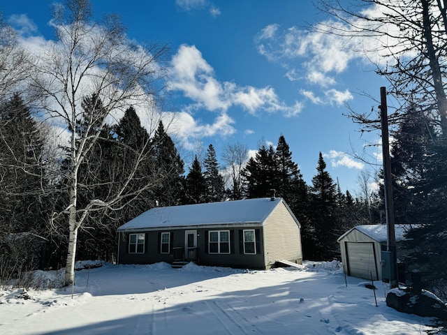 view of front of home with an outbuilding and a garage