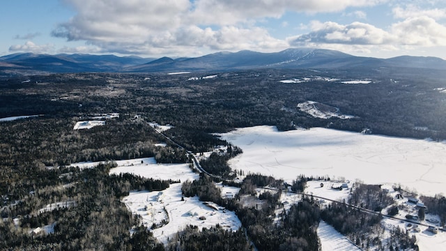 snowy aerial view featuring a mountain view