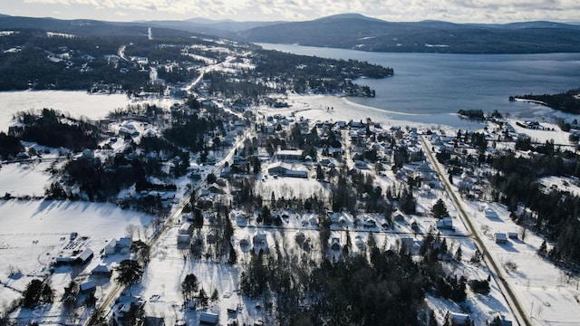 aerial view featuring a water and mountain view