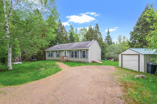 17 Saddleback Vw, Rangeley, ME 04970 - view of front of house with dirt driveway, a garage, an outbuilding, a front yard, and roof with shingles