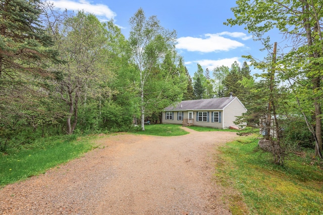 17 Saddleback Vw, Rangeley, ME 04970 - ranch-style home with dirt driveway, a view of trees, and a front yard