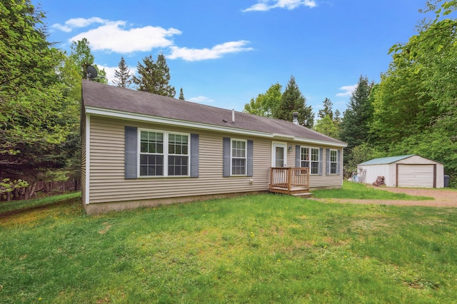17 Saddleback Vw, Rangeley, ME 04970 - view of front of house featuring a garage, an outdoor structure, and a front lawn