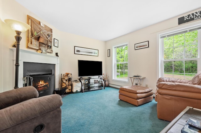 17 Saddleback Vw, Rangeley, ME 04970 - living area with carpet flooring, a lit fireplace, and baseboard heating