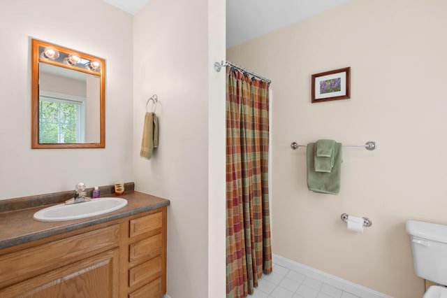 17 Saddleback Vw, Rangeley, ME 04970 - full bathroom with toilet, vanity, tile patterned flooring, a shower with shower curtain, and baseboards