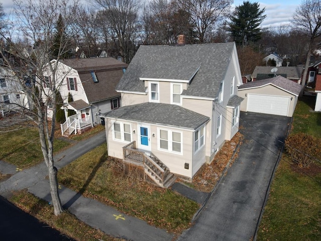 view of front of home featuring a garage and an outdoor structure