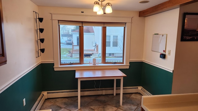 dining area featuring an inviting chandelier