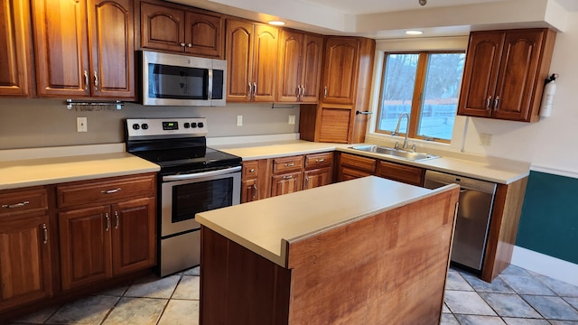 kitchen with light tile patterned flooring, sink, and stainless steel appliances