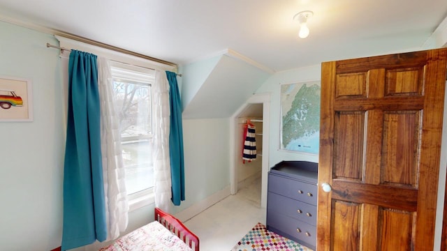 bedroom with lofted ceiling